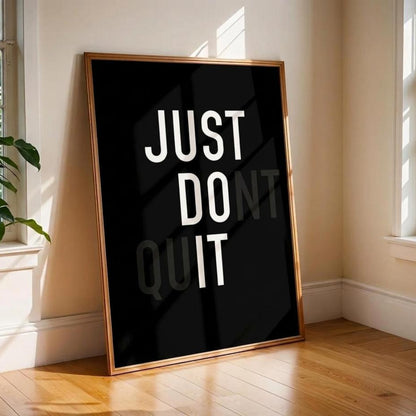 Framed poster with 'JUST DO IT' text in a room with windows and a plant.