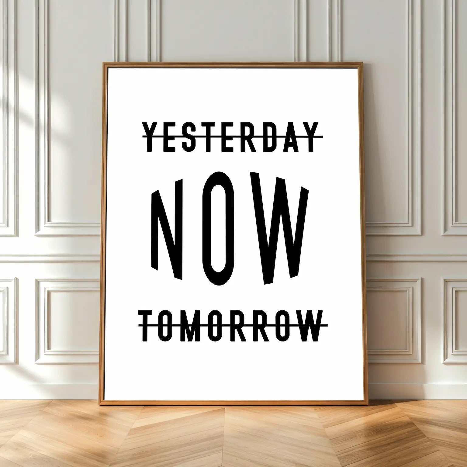 Framed poster with 'Yesterday Now Tomorrow' text on a wall.