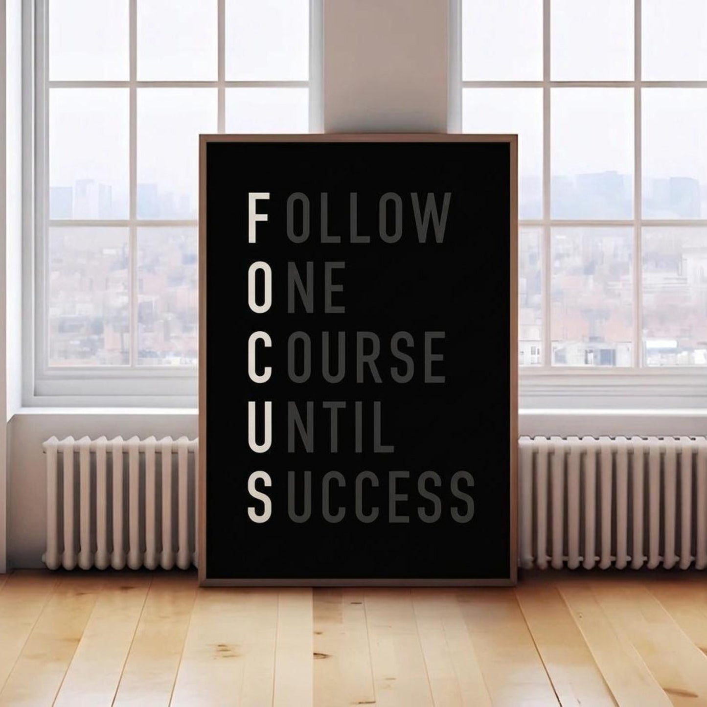 Motivational poster with text 'Follow One Course Until Success' in a room with large windows.
