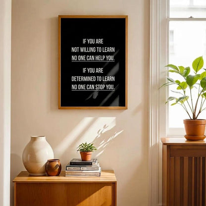 A framed motivational wall art print with white text "If You Are Not Willing To Learn, No one can help you. If you are determined to learn, no one can stop you."