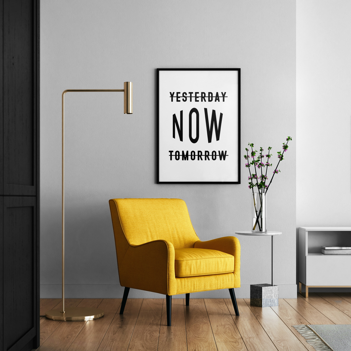Modern living room with a yellow armchair, gold floor lamp, and motivational poster.