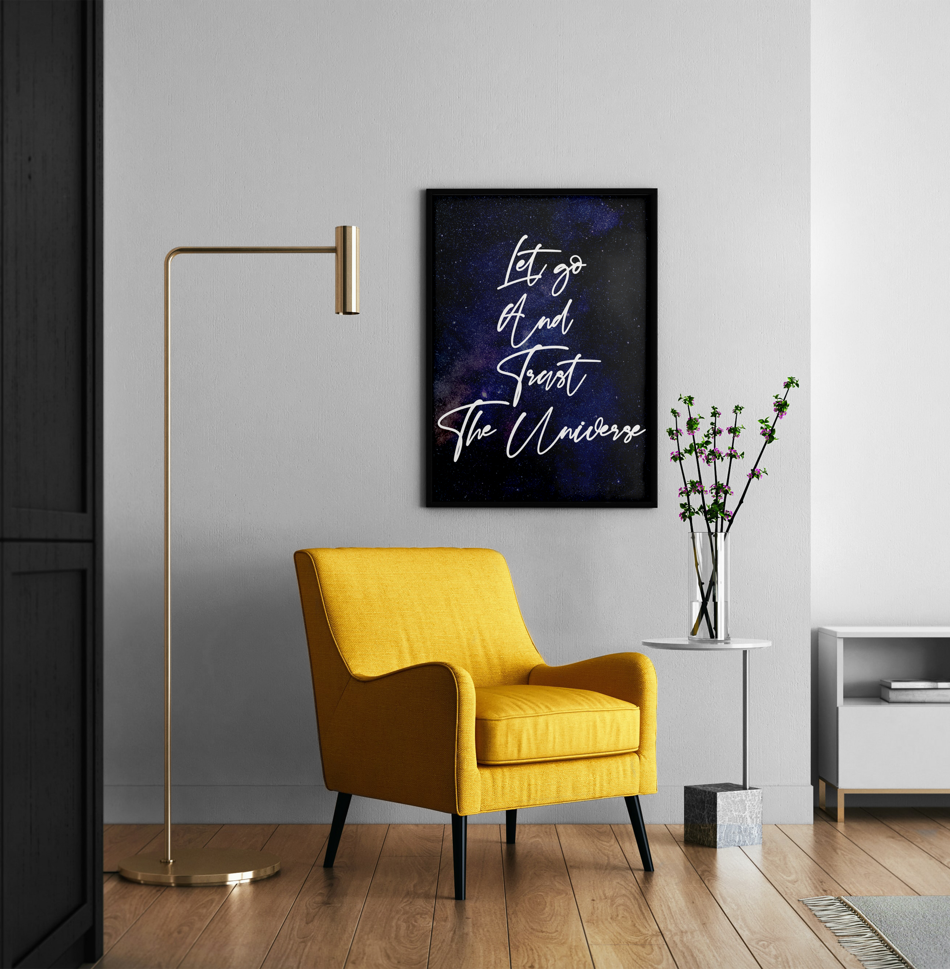 A framed wall art print with the quote 'Let go of and Trust The Universe' in white script over a dark galaxy background
