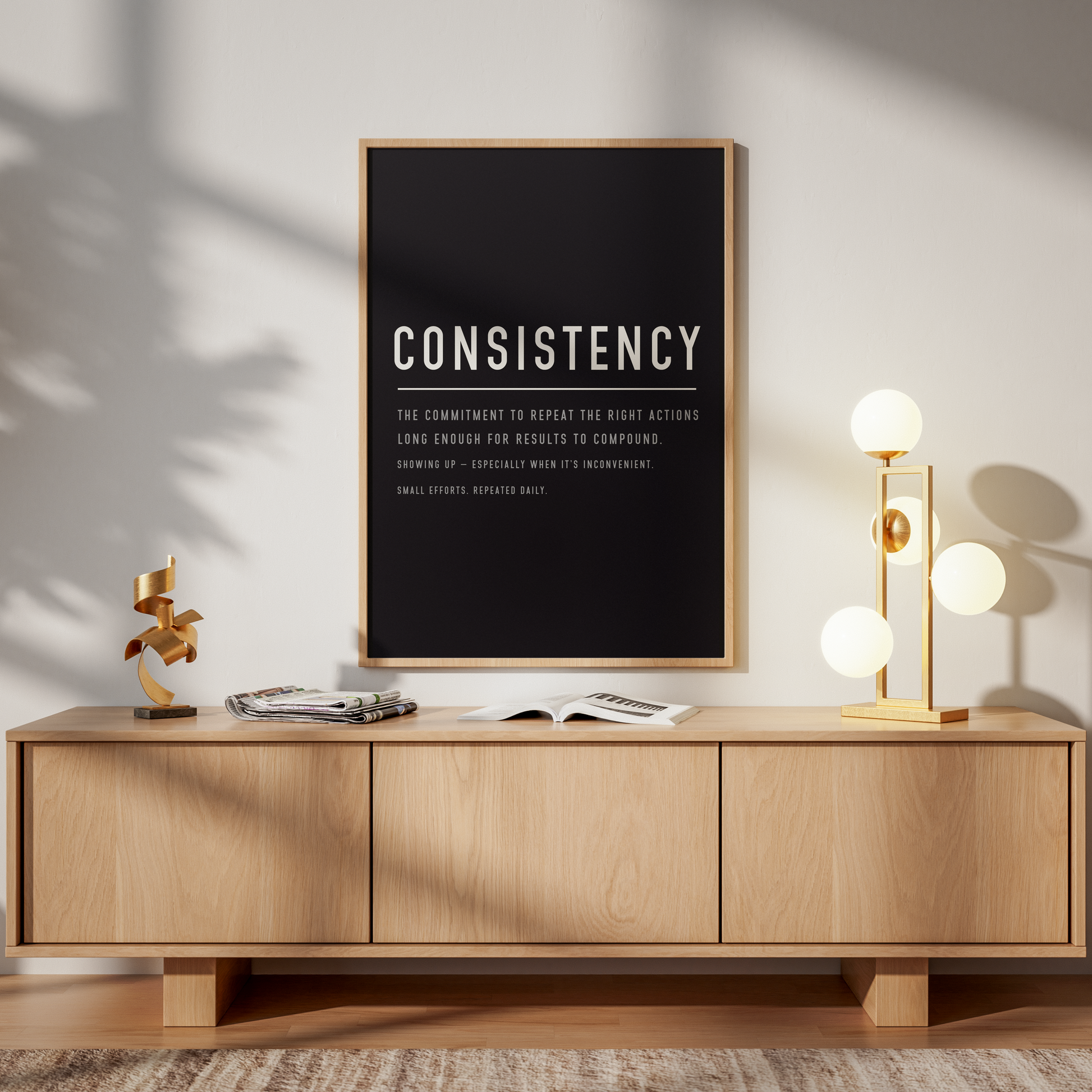 Wooden sideboard with 'The Matrix' poster above it in a room with a lamp and chair.