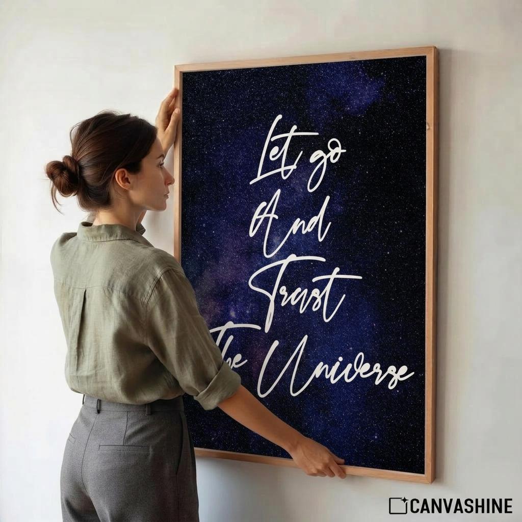 Poster featuring a dark blue and purple galaxy background with white script text that reads 'Let go And Trust The Universe'.