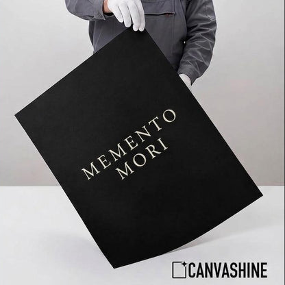 A promotional graphic for a Canvashine MEMENTO MORI poster. The left side features a beige text panel detailing the 'Professional Giclée Quality' of the print, including paper thickness, archival ink, matte finish, and longevity.